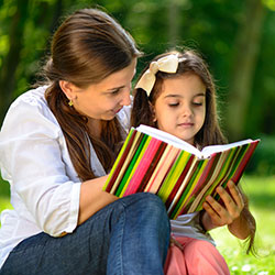 Happy latino family reading book